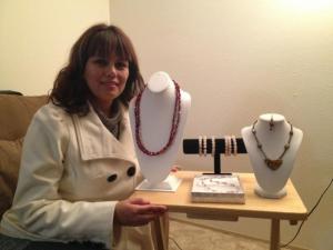 Hilda Leyva showcases her handmade jewelry. Craft vendors like Hilda will have the opportunity to sell at day tables and small stalls at the Mercado